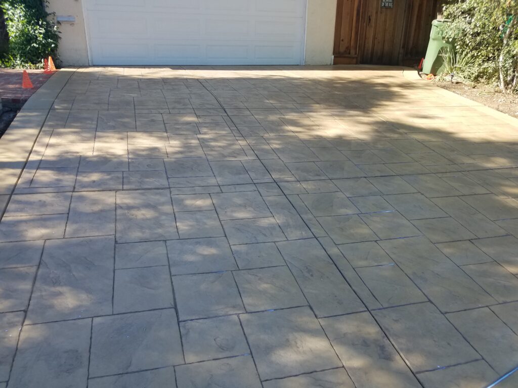 Stamped concrete patio with natural stone paving by a contractor serving San Jose and the South Bay